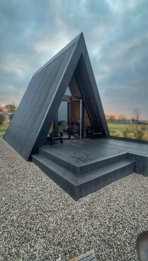 A black a-frame cabin
